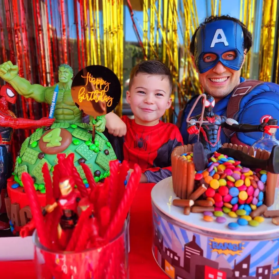 Captain America party entertainer with birthday boy in Spider-Man costume and Avengers-themed 4th birthday cake in Melbourne
